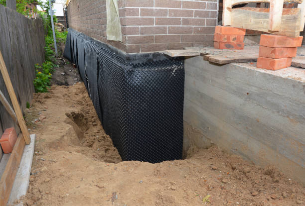 SJ Waterproofing Pros technician performing targeted Sump Pump Installation assessment in Uniontown, AL